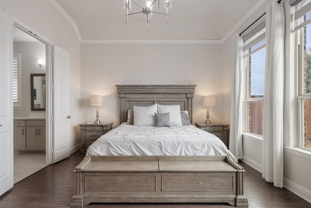 bedroom featuring ornamental molding, ensuite bath, dark wood finished floors, and baseboards