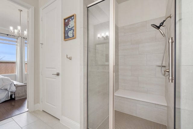 full bath featuring baseboards, a shower stall, ensuite bath, and tile patterned floors