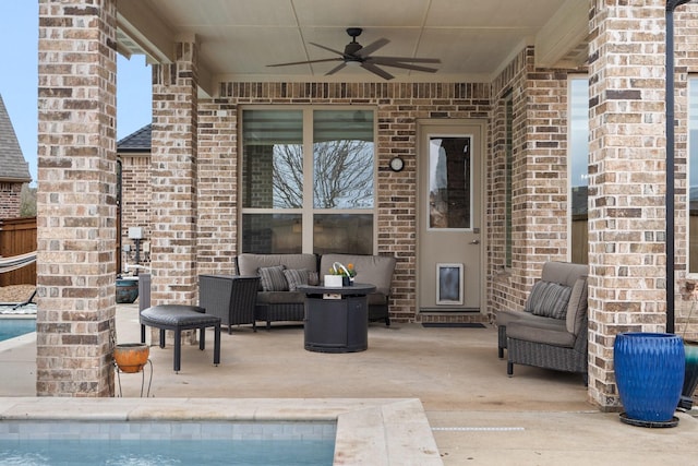 view of patio / terrace featuring an outdoor pool, ceiling fan, and outdoor lounge area