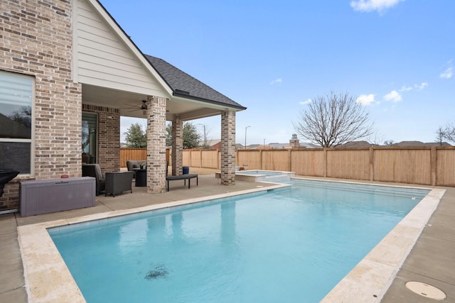 view of swimming pool featuring a patio, a fenced backyard, and a fenced in pool