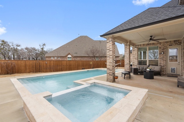 view of swimming pool with a fenced in pool, a ceiling fan, a fenced backyard, an in ground hot tub, and a patio area