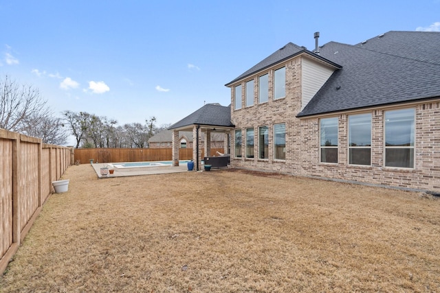 view of yard with a patio area and a fenced backyard