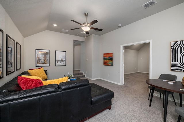 home theater room featuring carpet floors, lofted ceiling, visible vents, and baseboards