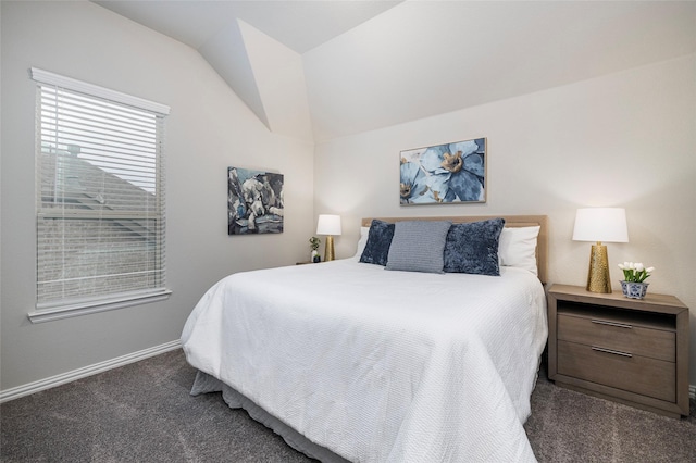 bedroom with lofted ceiling, carpet, and baseboards