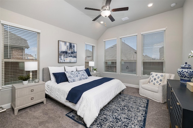 carpeted bedroom with lofted ceiling, multiple windows, visible vents, and baseboards