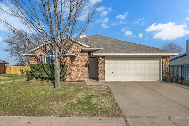 ranch-style house with brick siding, fence, a front yard, driveway, and an attached garage