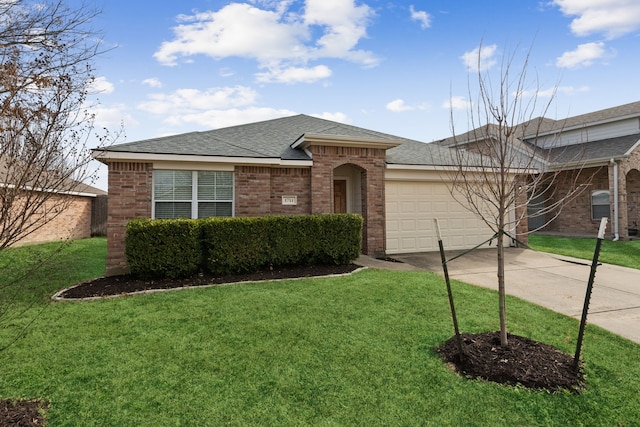 ranch-style house featuring a front yard and a garage