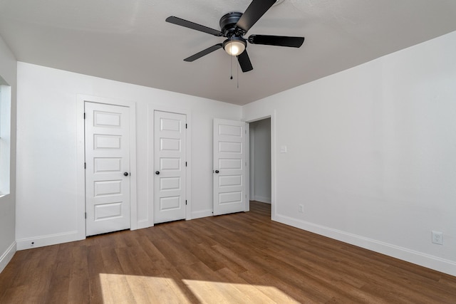 unfurnished bedroom featuring hardwood / wood-style floors and ceiling fan