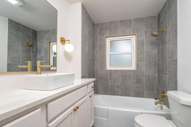 full bathroom with toilet, vanity, and tiled shower / bath combo