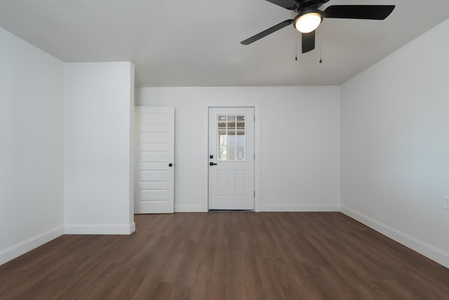 unfurnished room featuring ceiling fan and dark hardwood / wood-style flooring