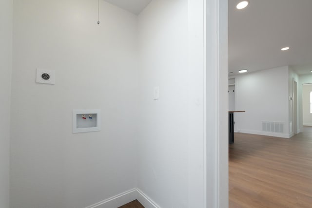 laundry area featuring hardwood / wood-style flooring, washer hookup, and hookup for an electric dryer