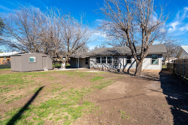 back of property featuring an outdoor structure