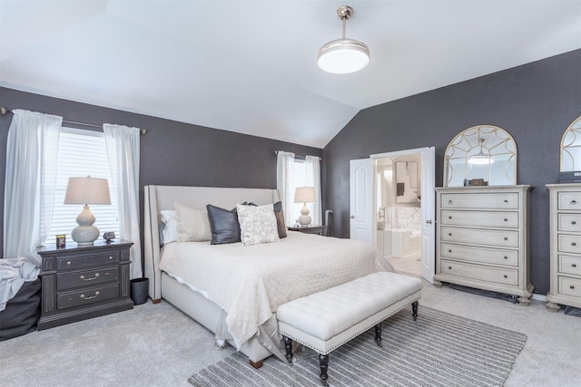 2745 Sunlight Dr, Little Elm, TX 75068 - carpeted bedroom featuring multiple windows, vaulted ceiling, and connected bathroom