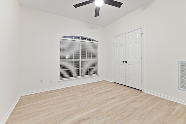 empty room featuring light hardwood / wood-style flooring and ceiling fan