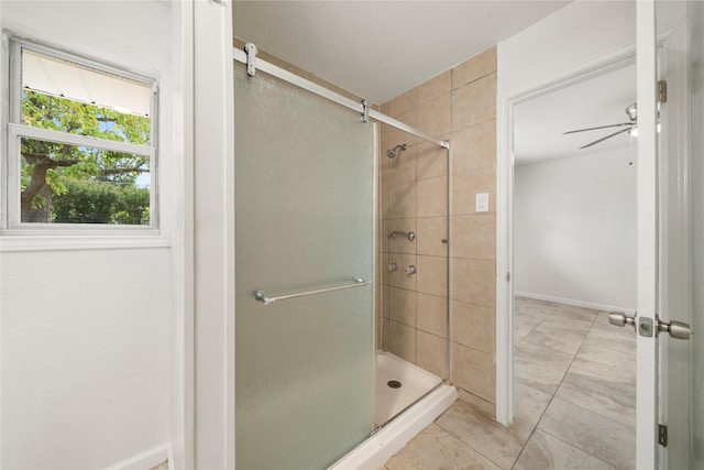 bathroom with ceiling fan, tile patterned flooring, and walk in shower