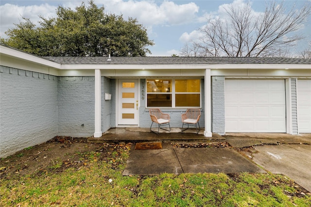 doorway to property featuring an attached garage