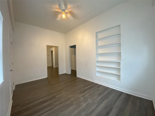 unfurnished bedroom with ceiling fan and dark hardwood / wood-style floors