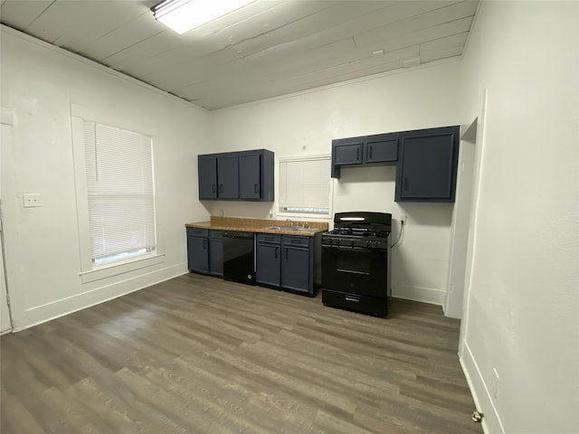 kitchen featuring dark wood-type flooring, black appliances, and sink