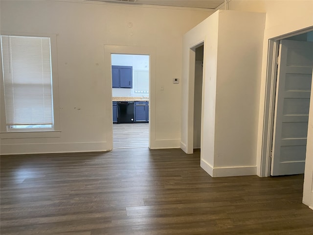 spare room featuring dark wood-type flooring