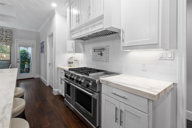 kitchen with white cabinetry, dark hardwood / wood-style flooring, tasteful backsplash, range with two ovens, and custom exhaust hood