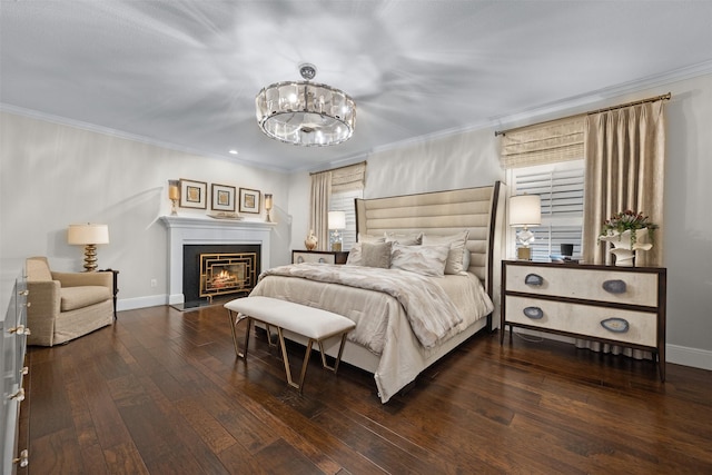 bedroom with hardwood / wood-style flooring, crown molding, and a notable chandelier