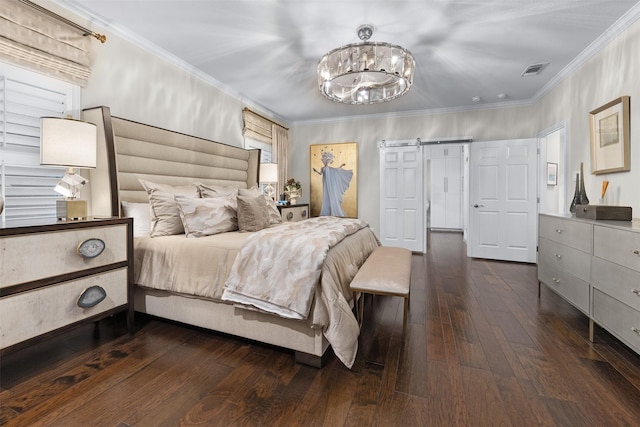bedroom featuring crown molding, dark hardwood / wood-style flooring, a barn door, and a notable chandelier