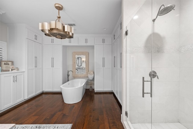bathroom featuring separate shower and tub and hardwood / wood-style floors