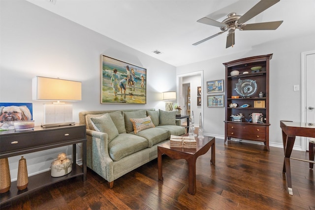 living room with dark wood-type flooring and ceiling fan