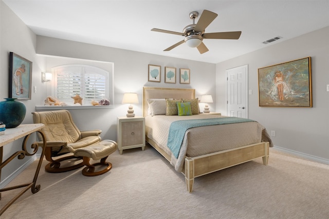 bedroom featuring ceiling fan and light carpet