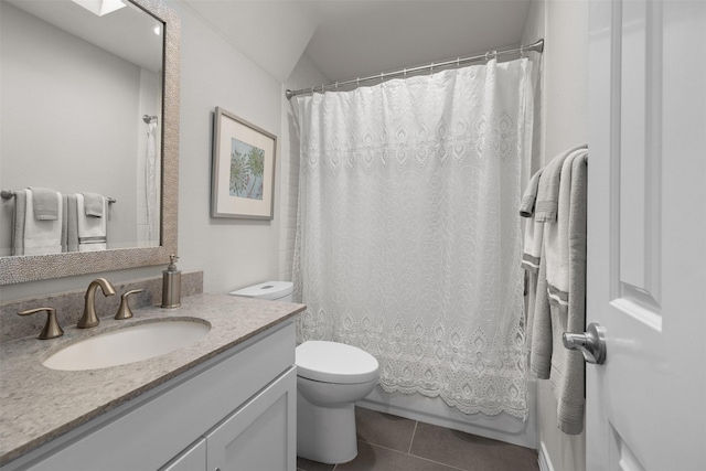full bathroom with shower / tub combo with curtain, vanity, toilet, and tile patterned floors