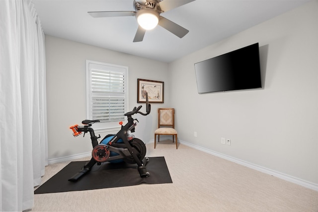 exercise area with light carpet and ceiling fan