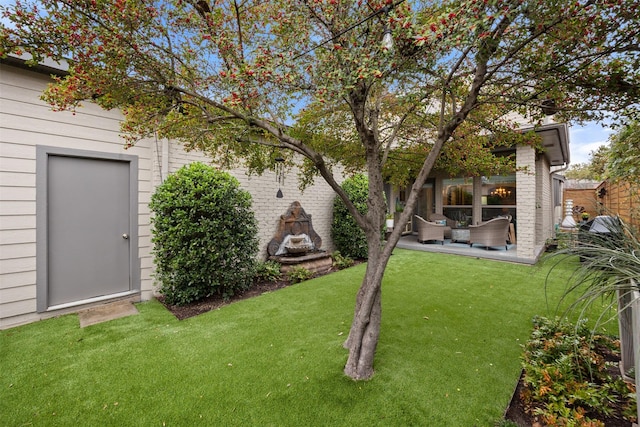 view of yard with a patio and an outdoor living space