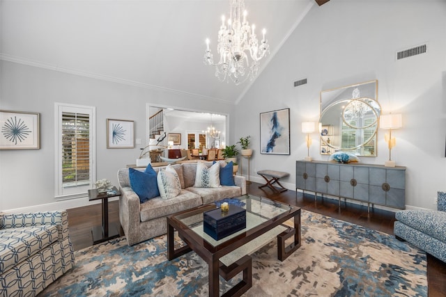 living room with ornamental molding, a chandelier, dark hardwood / wood-style floors, and high vaulted ceiling