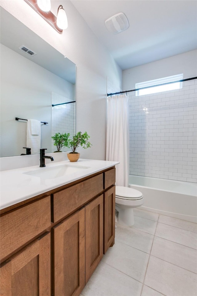 full bathroom featuring vanity, shower / bath combo, toilet, and tile patterned floors