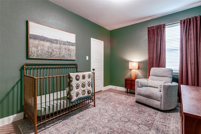 bedroom with a nursery area