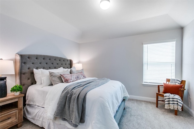 bedroom featuring light carpet