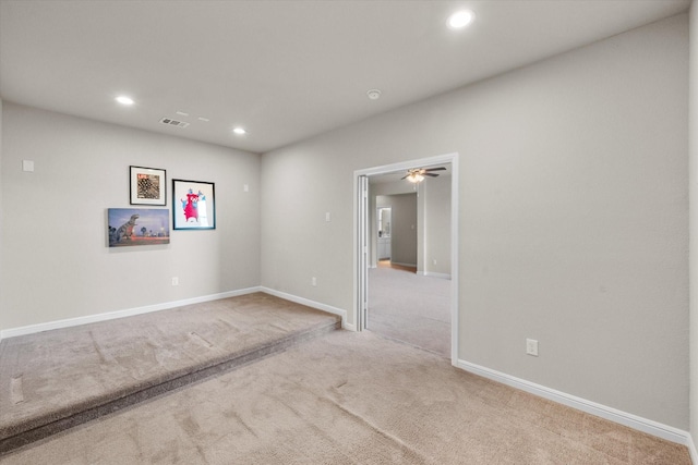 carpeted empty room featuring visible vents, baseboards, ceiling fan, and recessed lighting