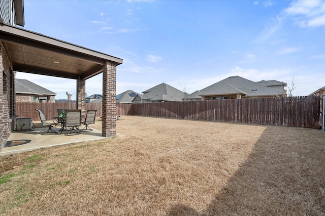 view of yard with a patio and a fenced backyard