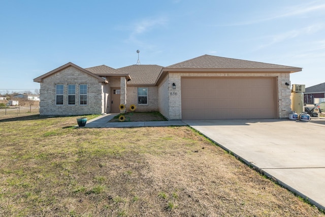 ranch-style home with a front yard and a garage