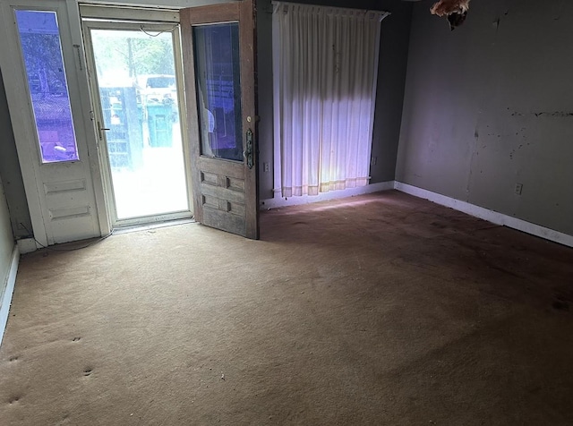 unfurnished room featuring carpet floors