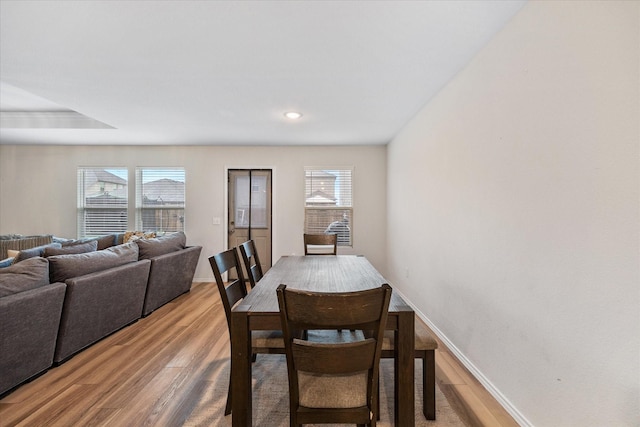 dining area with wood-type flooring