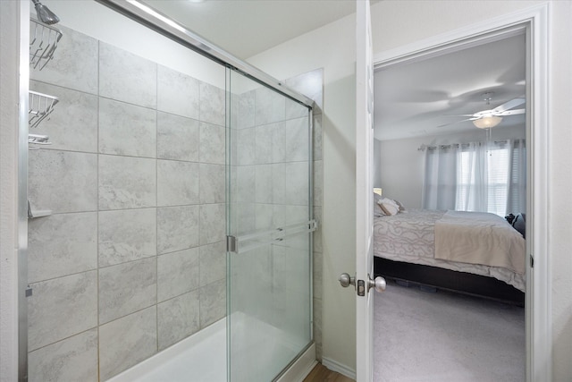 bathroom featuring an enclosed shower and ceiling fan