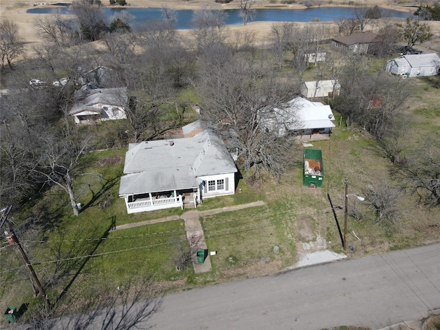 birds eye view of property featuring a water view