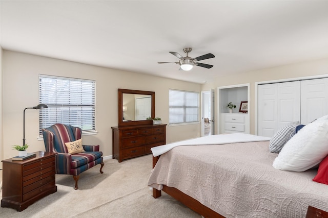 carpeted bedroom with a closet and ceiling fan