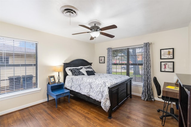 bedroom with ceiling fan and dark hardwood / wood-style floors