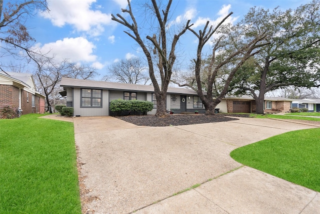 ranch-style home featuring a front yard and a garage