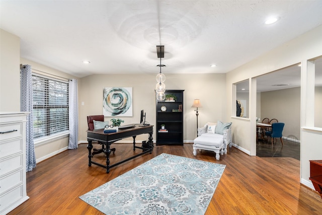 office featuring baseboards, wood finished floors, and recessed lighting