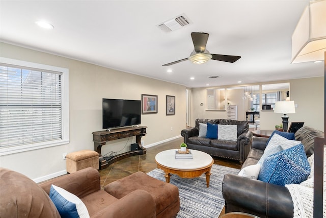 tiled living room featuring ceiling fan