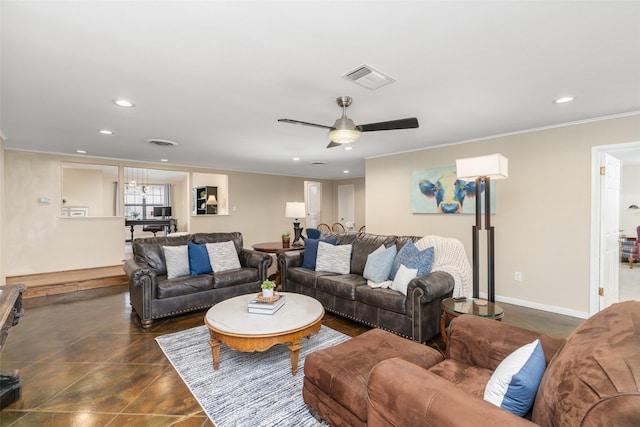 living room with ceiling fan and crown molding