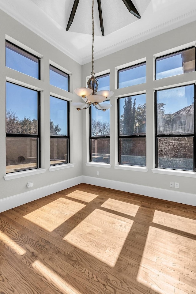 unfurnished sunroom featuring a notable chandelier